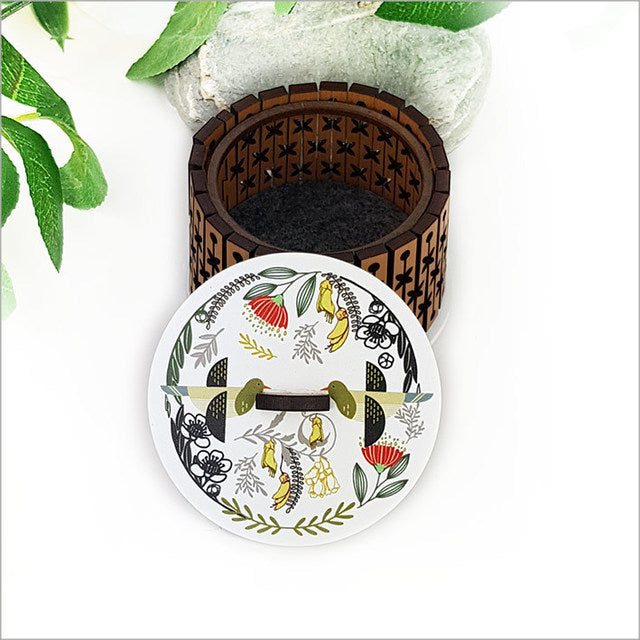 Round trinket box with vibrant Kiwi Kereru design, crafted from NZ Rimu veneer and acrylic, ideal for storage or decor.