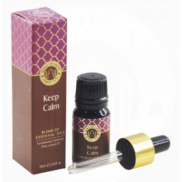 Amber bottle of Keep Calm Essential Oil, featuring a soothing blend of Sandalwood, Patchouli, Pine, and Lemon for stress relief.