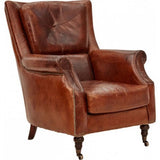 Vintage cigar armchair in full grain leather, with a solid birch frame, plush cushioning, and elegant brass nail detailing.