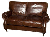 Vintage Cigar 2-seater leather sofa with birch frame, luxurious cushioning, and earthy tones, perfect for stylish living rooms.