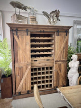 Rustic bar and wine unit with sliding doors, reclaimed pine, and iron, perfect for stylish beverage storage.