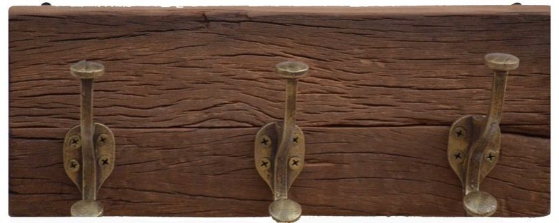 Set of 3 rustic wooden coat hooks with antique metal accents, perfect for enhancing home decor and adding functional storage.