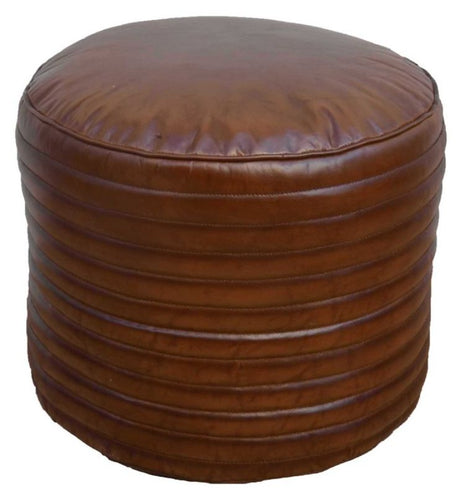 Round buffalo leather ottoman, perfect as a footrest or chic seating, adds rustic charm and warmth to any modern living space.