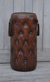 Vintage leather umbrella basket in rich brown, combining elegance and functionality for stylish entryway storage.