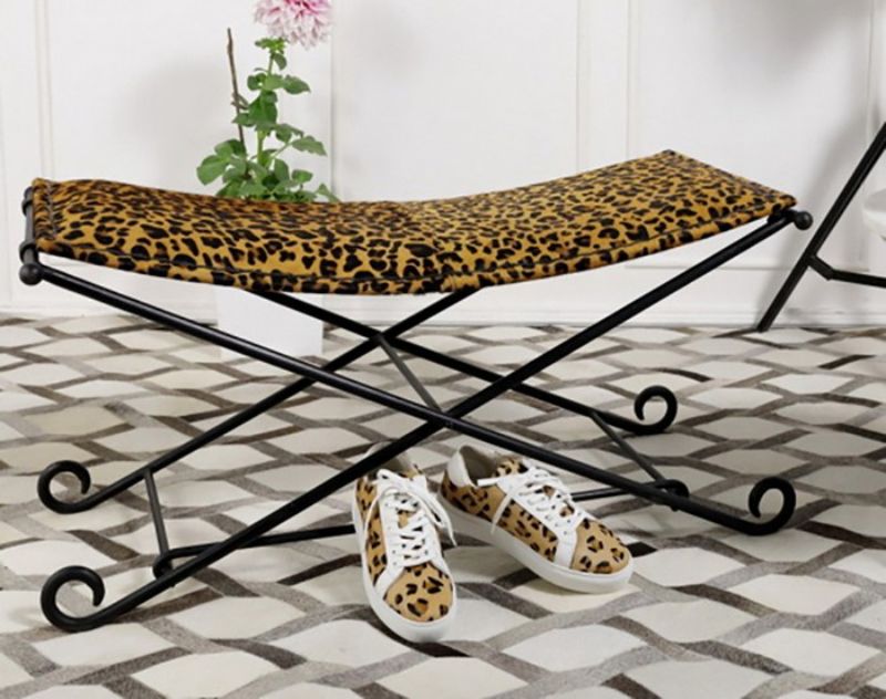 Leopard print leather long stool with durable iron frame, perfect for stylish seating and home decor enhancement.