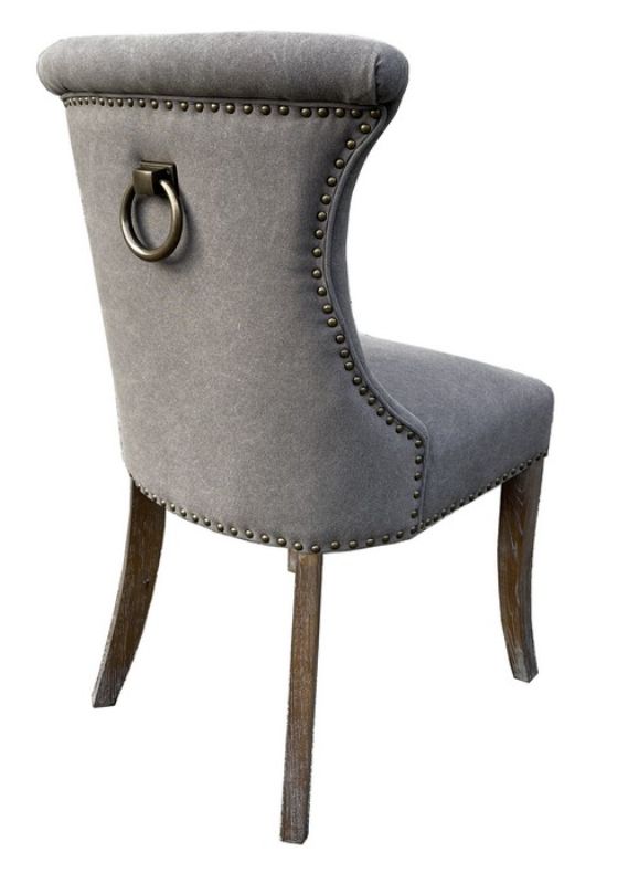 Elegant Miami dining chair in grey canvas with oak legs, featuring antique brass detailing for a sophisticated touch.