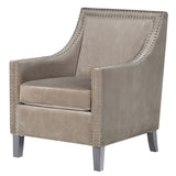 Light grey velvet Port Royal armchair featuring studded detailing and a solid timber frame, perfect for modern interiors.