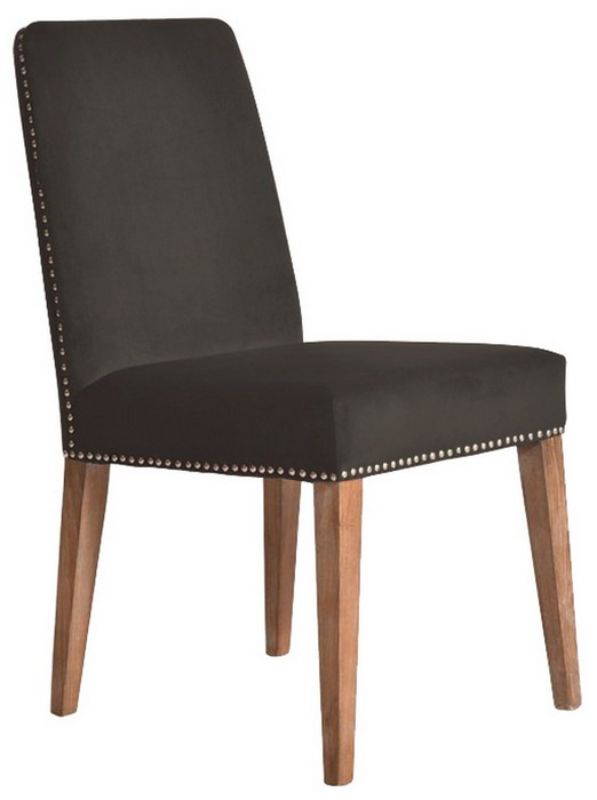 Dark grey velvet dining chair with antique studs, combining luxury and elegance for a sophisticated dining experience.