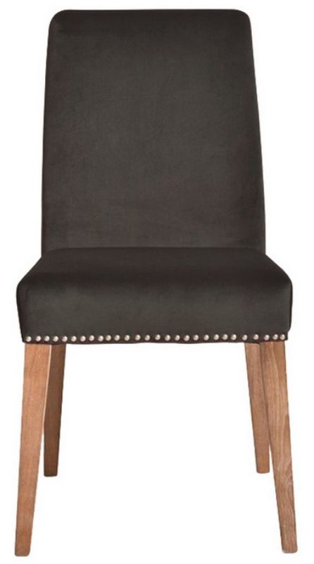 Elegant dark grey velvet dining chair with antique studs and solid timber frame, perfect for sophisticated dining settings.