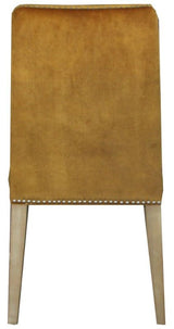 Elegant dark mustard velvet dining chair with antique studs and a solid timber frame, adding sophistication to any dining space.