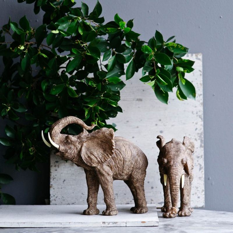 Elegant 38cm polyresin elephant figurine, featuring a raised trunk symbolizing good fortune, ideal for home decor enhancement.