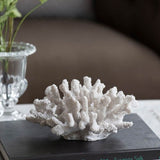 Bright white faux coral ornament in intricate polyresin design, perfect for adding coastal charm to any decor.