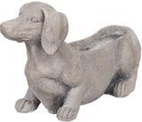 Charming dog-shaped planter for vibrant blooms or succulents, featuring a neutral gray finish and durable design.