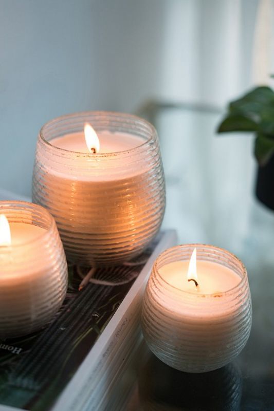 Scented Soy Wax Candle in Earl Grey, elegantly styled in a gold foil holder, perfect for creating a cozy ambiance.