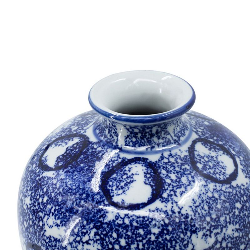 Elegant blue and white porcelain vase with abstract patterns, ideal for showcasing flowers or as a statement decor piece.