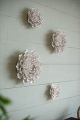 Handmade 15cm cream ceramic flower wall decor with textured petals, perfect for elevating any living space or display.