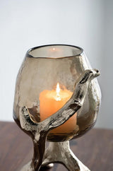 Deep olive glass pillar candle holder with textured gold aluminum frame, perfect for elegant home decor accents.