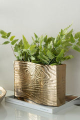 Small rectangular gold aluminium vase with elegant wavy design, perfect for fresh flowers or as a standalone decor piece.