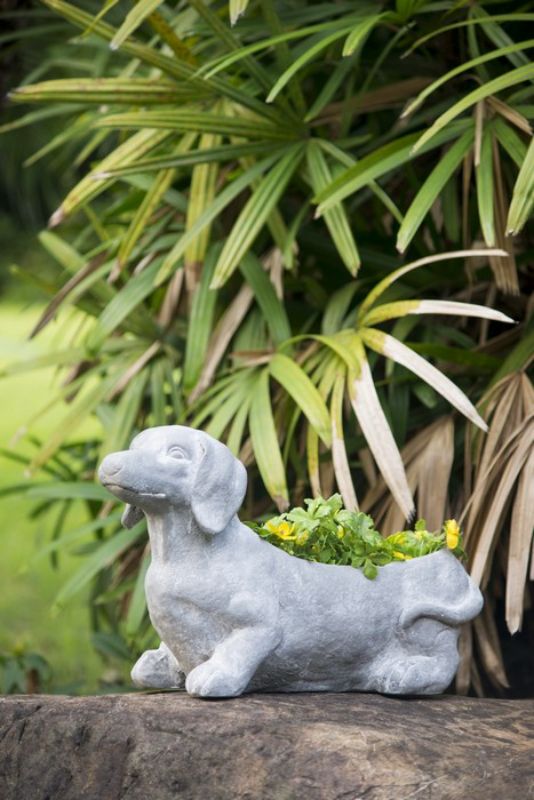 Whimsical dog-shaped planter (51cm) in neutral gray, perfect for showcasing blooms or herbs indoors and outdoors.