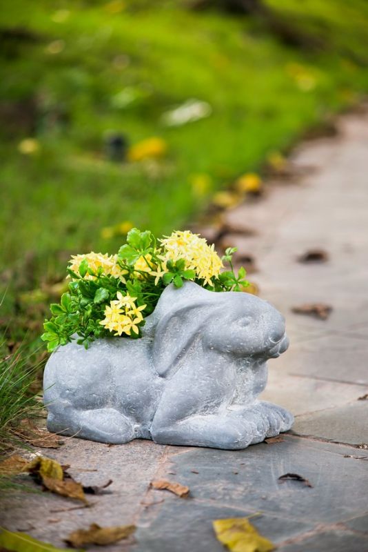 30cm Rabbit Planter in neutral gray, made of durable fibreglass resin, perfect for showcasing colorful plants indoors or outdoors.