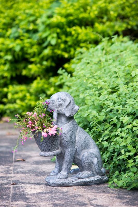 Charming dog-shaped planter in neutral gray, perfect for indoor and outdoor plants, adding whimsical character to any space.