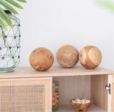 Set of three large decorative teak balls, showcasing exquisite wood grain texture for a warm, elegant home accent.