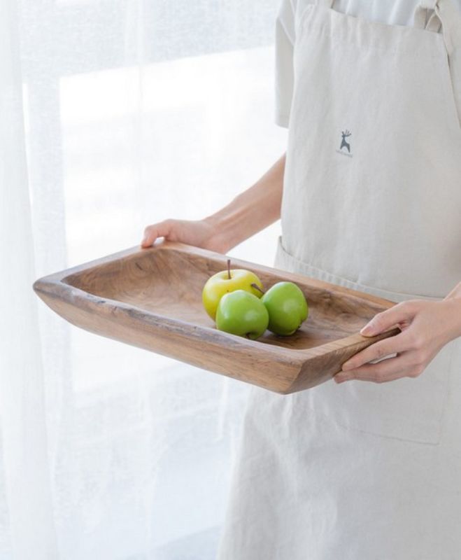 Rectangular 100% teak wood tray measuring 40cm x 50cm, showcasing unique grain for elegant serving and display.