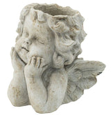 Off-white cherub angel planter with sculpted wings, ideal for displaying small plants on tabletops or windowsills.