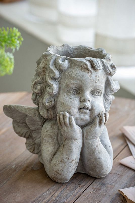 Off-white cherub angel planter with sculpted wings, perfect for small plants, adding charm to any decor.