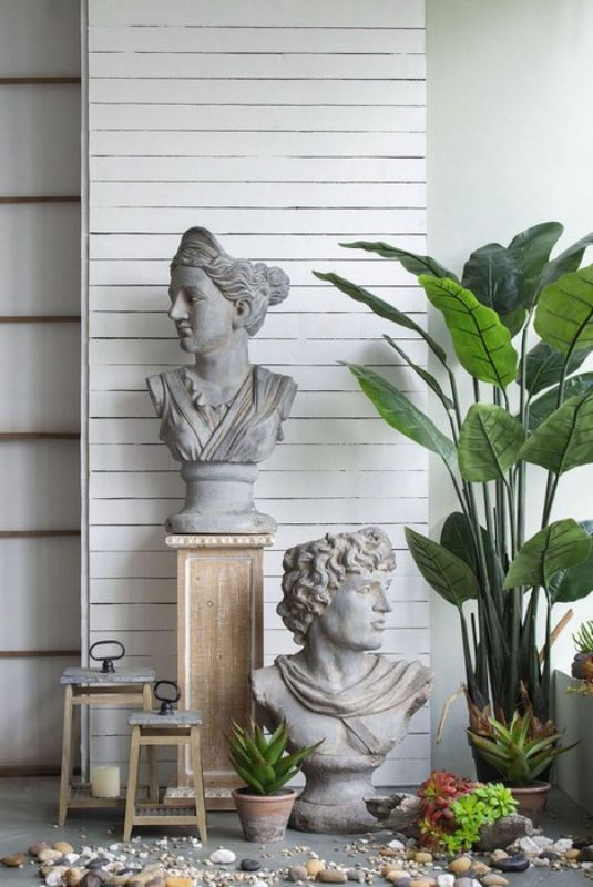 A 78cm tall gray bust statue of a crowned goddess, adding timeless elegance and tranquility to any outdoor garden space.