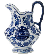 Elegant 23cm blue and white chinoiserie milk jar with sculpted handle, perfect for traditional kitchen decor.