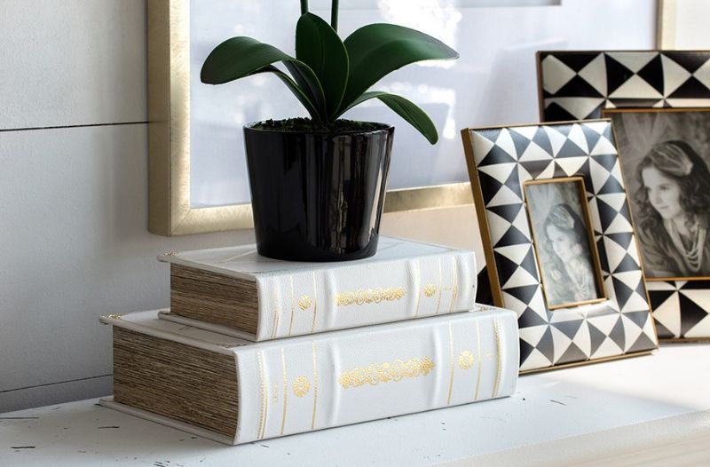 Elegant white and gold faux leather book boxes for stylish storage, measuring 27cm x 17.5cm x 6.5cm, perfect for decor.