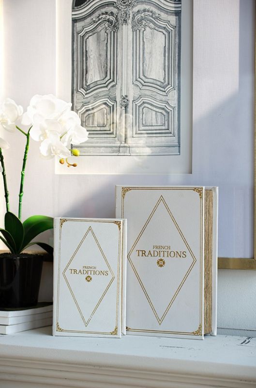 Chic white and gold faux leather book boxes for stylish storage, perfect for organizing keepsakes and enhancing decor.