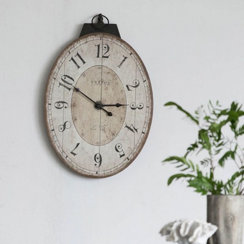 Elegant 74cm wall clock with a weathered finish, decorative numerals, perfect for enhancing any home decor style.