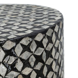 Black accent stool/table with geometric capiz inlay, 45cm high, versatile for seating or as a stylish tabletop in modern décor.