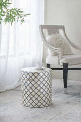 Accent stool/table with a chic black and cream diamond pattern, featuring elegant capiz inlay for versatile use.