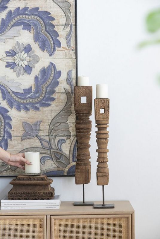 Antique carved pillar candle holder, 114cm tall, featuring intricate wood and metal design for elegant tabletop decor.