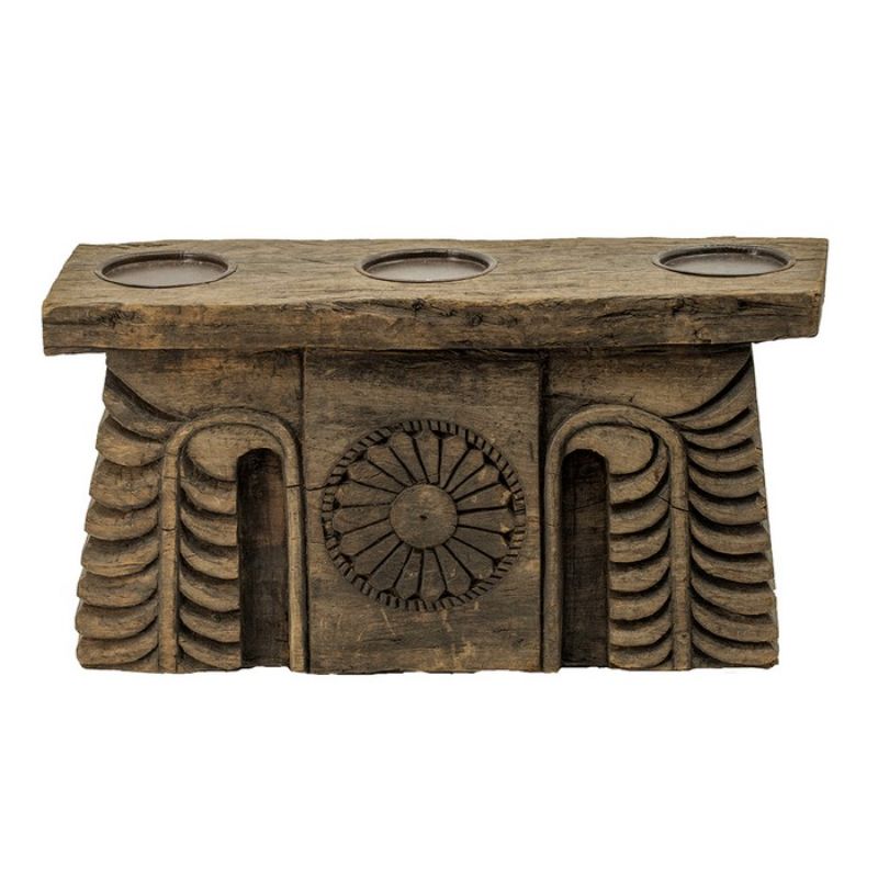 Antique carved pillar candle holder in black, showcasing intricate wood designs and holding three candles for elegant decor.