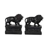 Whimsical lion bookends in glossy black resin, perfect for organizing books while enhancing home decor charm.