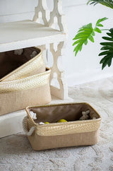 Set of 3 stylish jute baskets with gold accents and rope handles for versatile home organization and easy portability.