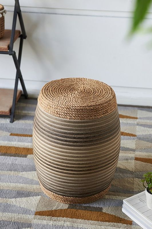 Rattan Drum Ottoman featuring vibrant rattan wrap, barrel shape, and blue-gray tones; ideal for decor and versatile use.