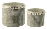 Sage green planters set of 2 featuring tassel trim, crafted from durable rattan for indoor or outdoor decor.