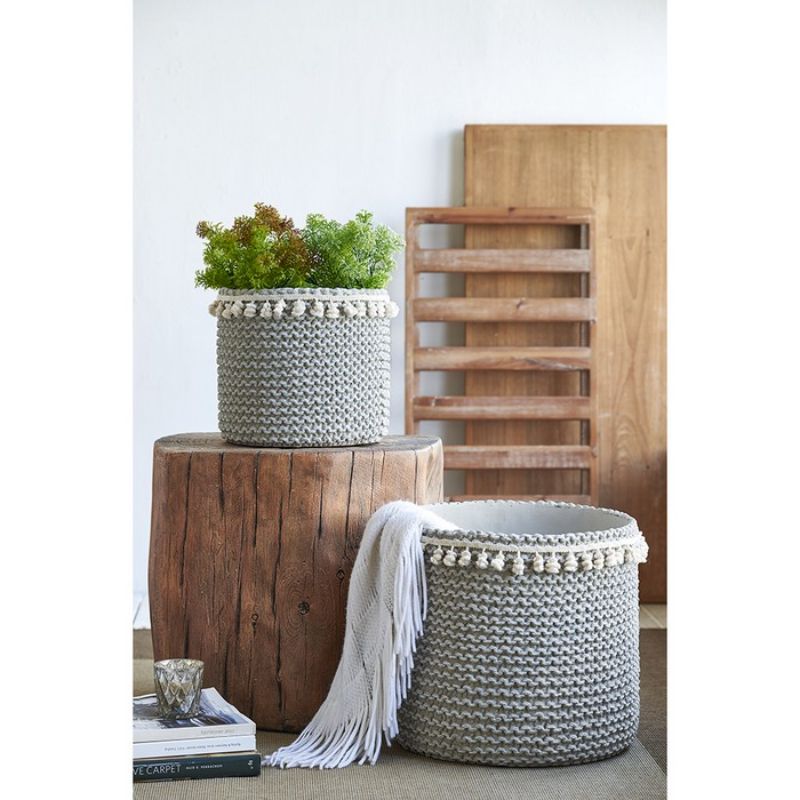 Sage green rattan planters set of 2 with tassel trim, perfect for indoor or outdoor plant displays.