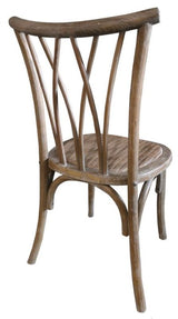 Elegant elm and rattan bentwood dining chair in antique oak, perfect for rustic or historical dining settings.