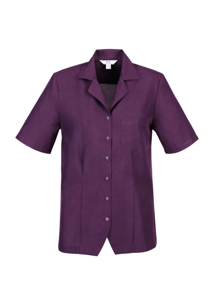 Ladies Plain Oasis Overblouse in grape, featuring breathable fabric, side splits, and chest pocket for a chic, comfortable fit.