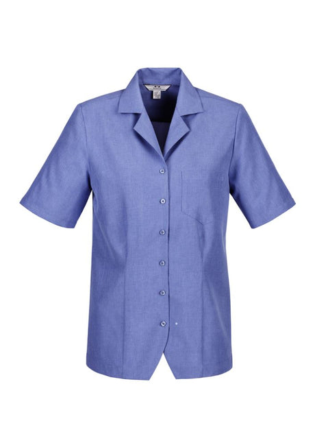 Mid blue ladies overblouse in size 22, featuring breathable fabric, action back pleats, and a chest pocket. Stylish and comfortable.