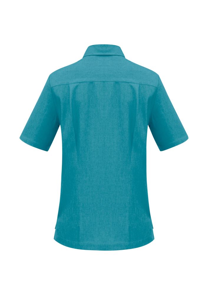 Teal ladies overblouse with action back pleats, long length, and left chest pocket, crafted from breathable polyester.