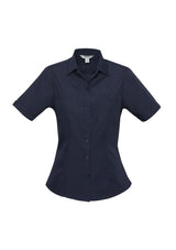 Navy ladies short sleeve shirt size 10 with twin chest pockets, curved hem, UPF protection, and stylish design by Biz Collection.