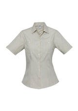 Ladies Bondi Short Sleeve Shirt in Sand, Size 10, features twin chest pockets and a stylish curved hem for versatile wear.