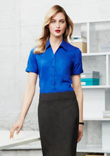 Ladies Monaco Short Sleeve Shirt in white, size 8, featuring a Y-neckline, turn-back cuffs, and comfortable stretch fabric.
